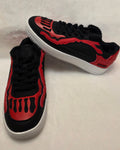 Bred Bones red and black skeleton sneakers on white background