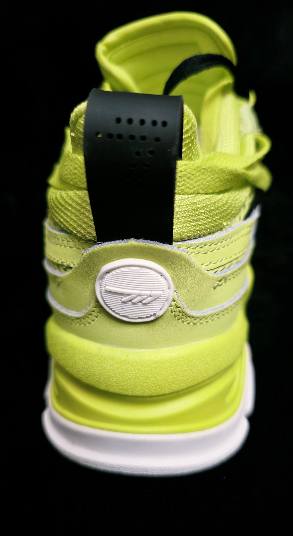 Watson Volt Triple Youth Sneakers - heel view with Watson circle logo medallion and black perforated pull tab