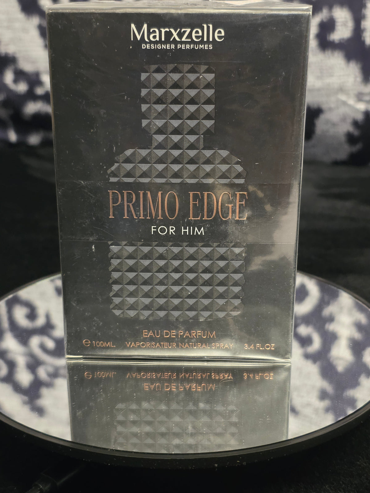 Marxzelle Primo Edge For Him Eau de Parfum 100mL box - sleek matte black diamond quilted embossed packaging with rose gold PRIMO EDGE FOR HIM typography and Marxzelle Designer Perfumes header