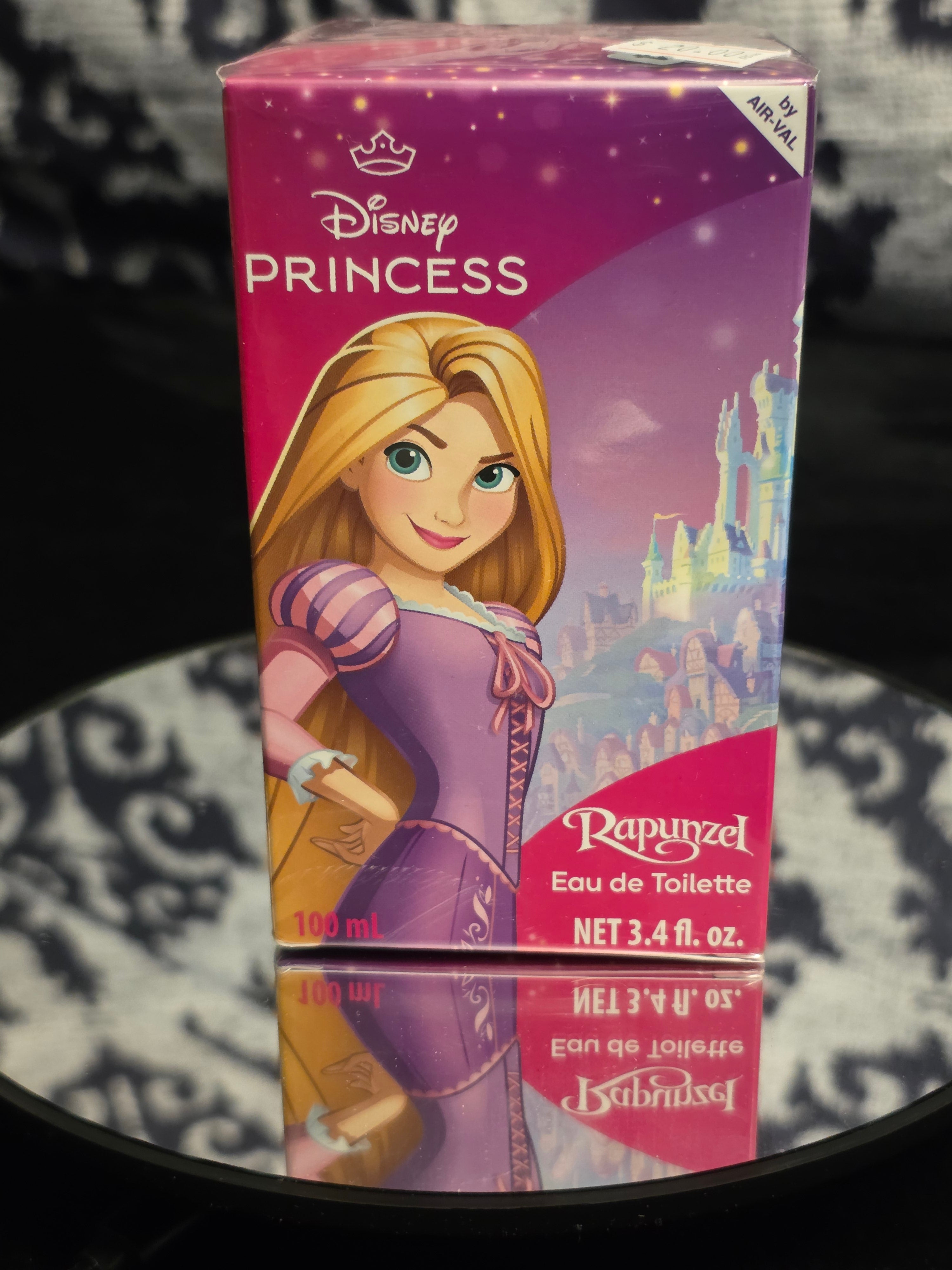 Disney Princess Rapunzel Eau de Toilette 100mL by Air Val - vibrant hot pink Disney Princess box featuring Rapunzel in purple dress with enchanted castle backdrop