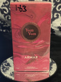 Armaf Delights Yum Yum Eau de Parfum 100mL box - bold deep rose pink sculptural wave embossed packaging with dark bronze Yum Yum medallion crest and Armaf Delights signature