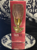 Valentine Eau de Parfum 50mL - stunning faceted blush pink rose bloom glass bottle on gleaming gold stem with gold leaves in deep crimson red window box packaging