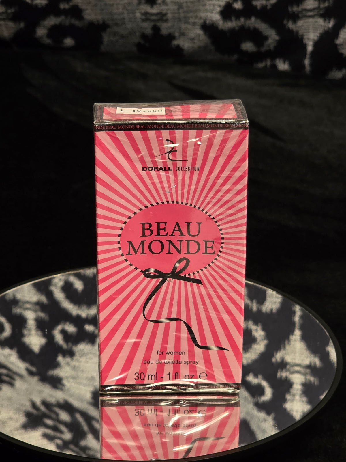 Dorall Collection Beau Monde For Women Eau de Toilette 30mL box - bold hot pink starburst sunray packaging with black BEAU MONDE oval logo and black ribbon bow