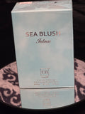 EB Sea Blush Intense Eau de Parfum 100mL box - soft powder blue mist packaging with rose gold SEA BLUSH Intense typography and embossed EB square crest logo
