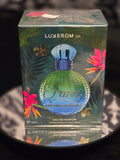 Luxxerom Co. Fancy Dreams Paradise Eau de Parfum 100mL box - lush deep teal tropical jungle packaging with vibrant hibiscus, bird of paradise and palm leaf artwork