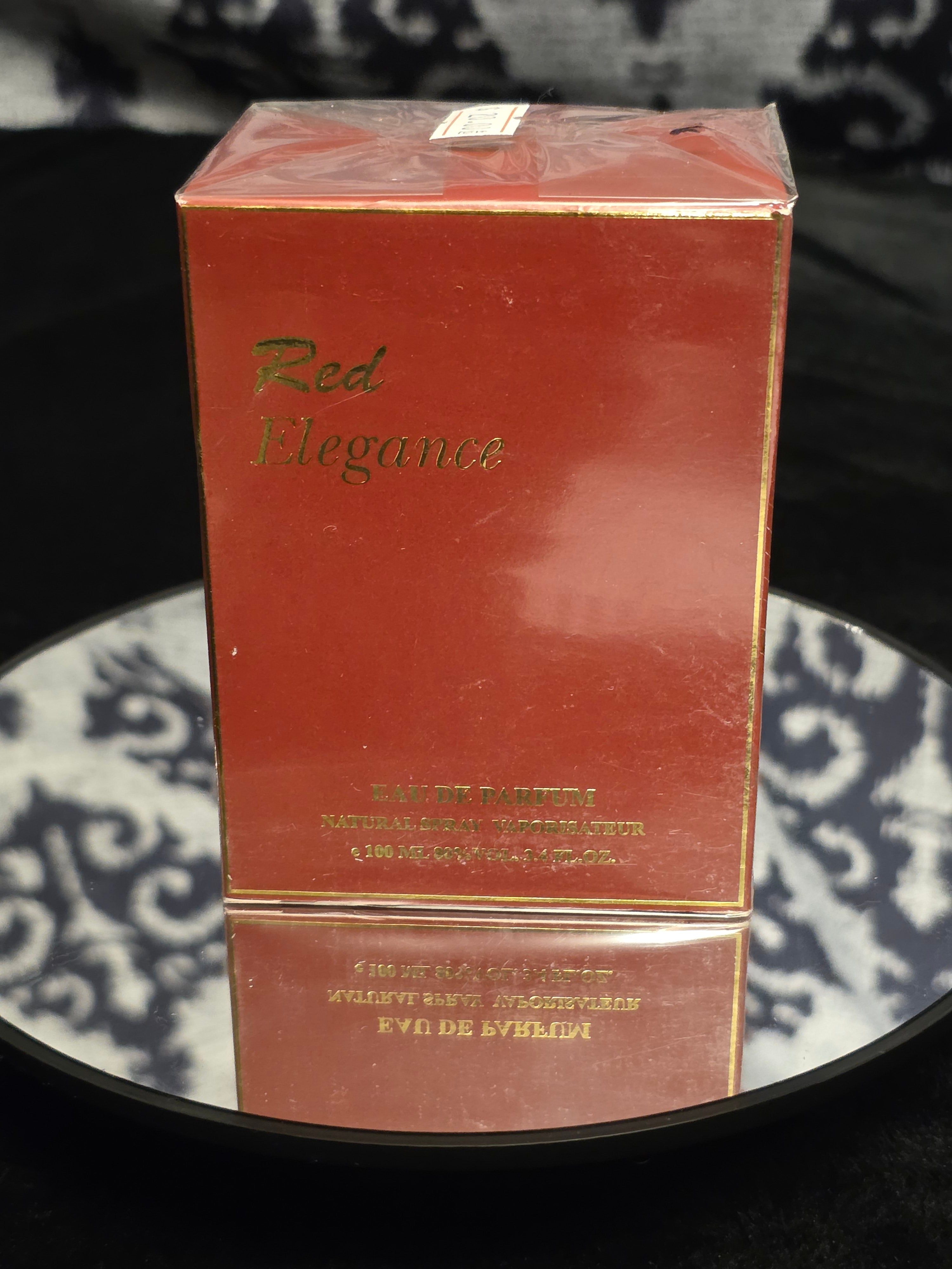 Red Elegance Eau de Parfum 100mL box - rich deep red packaging with gold trim and elegant gold script logo