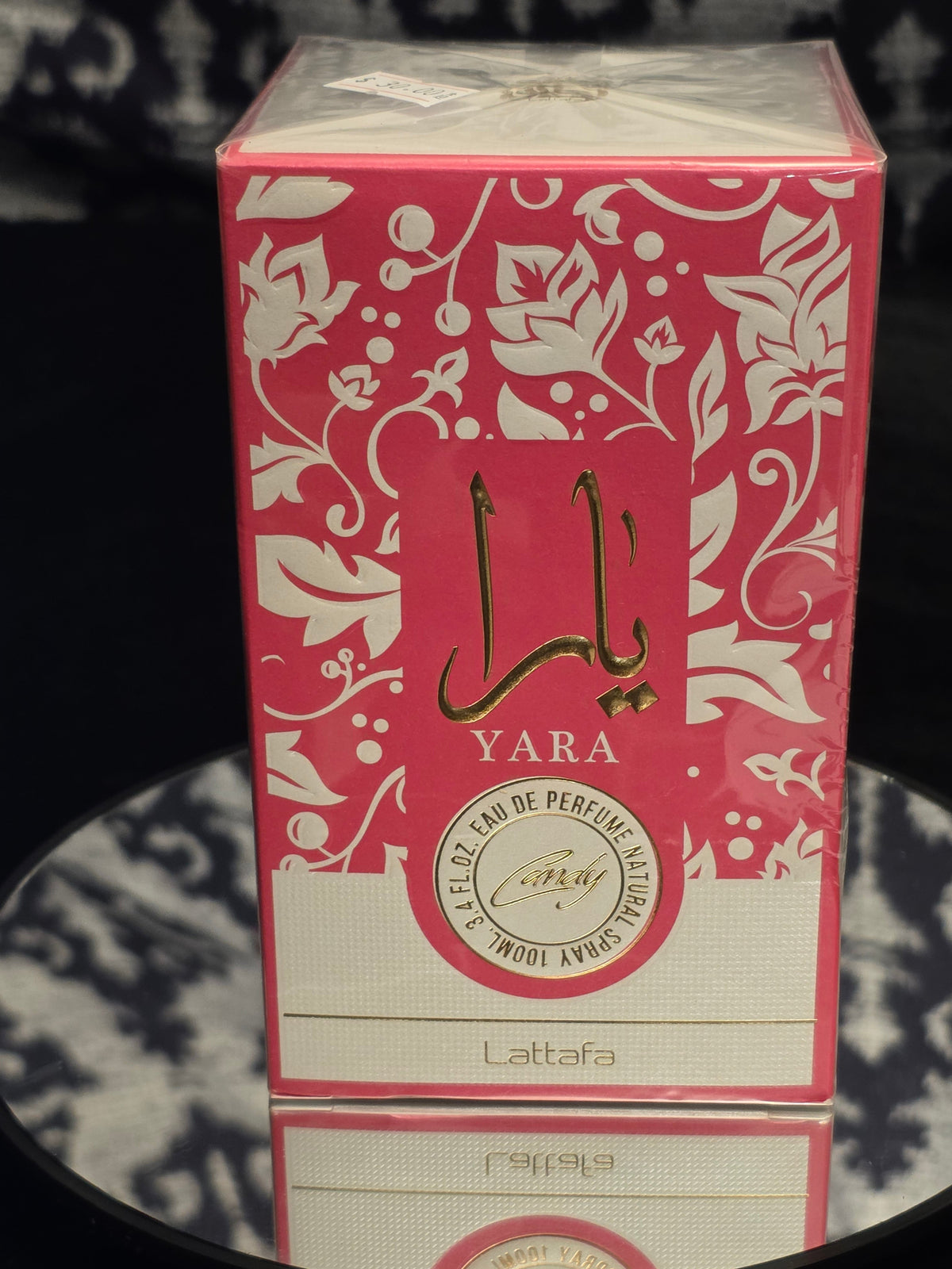 Lattafa Yara Candy Eau de Parfum 100mL box - vibrant hot pink and white floral packaging with Candy medallion seal and Arabic calligraphy