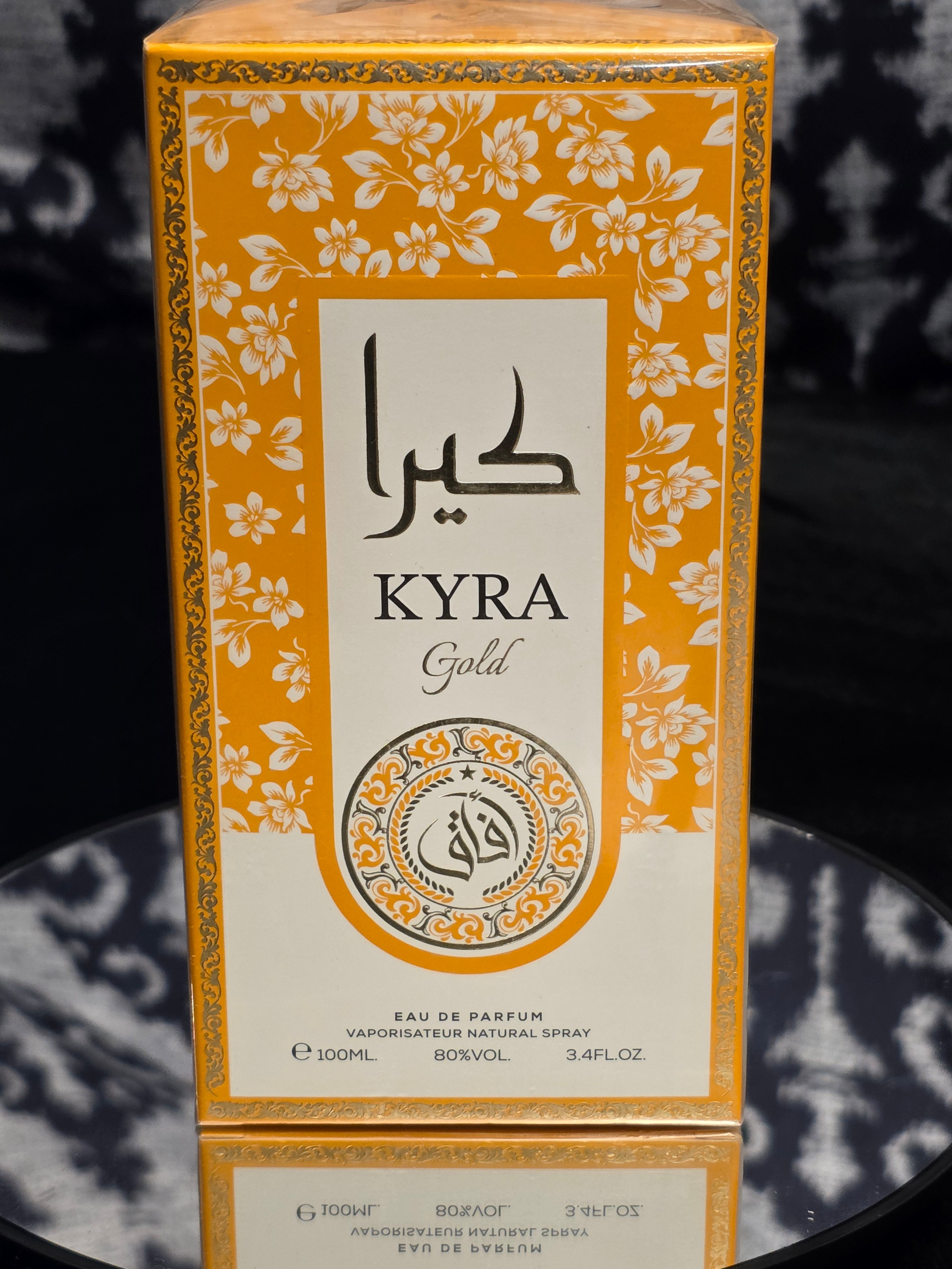 Kyra Gold Eau de Parfum 100mL box - vibrant gold and white floral packaging with Arabic calligraphy and ornate medallion seal