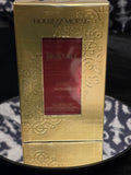 House of Morals Mustale Sweet Woods Eau de Parfum - brushed gold embossed box with crimson bottle window detail