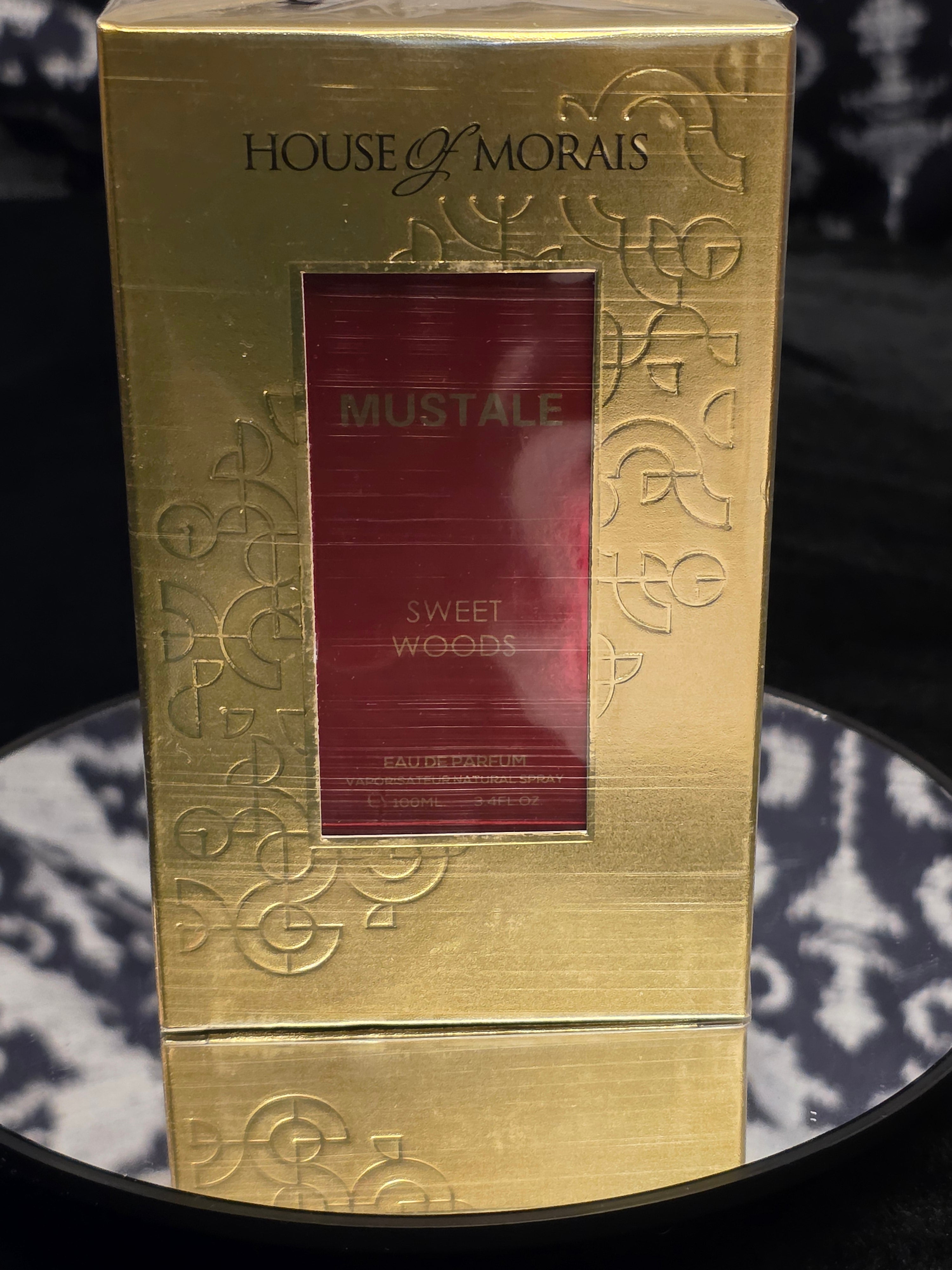 House of Morals Mustale Sweet Woods Eau de Parfum - brushed gold embossed box with crimson bottle window detail