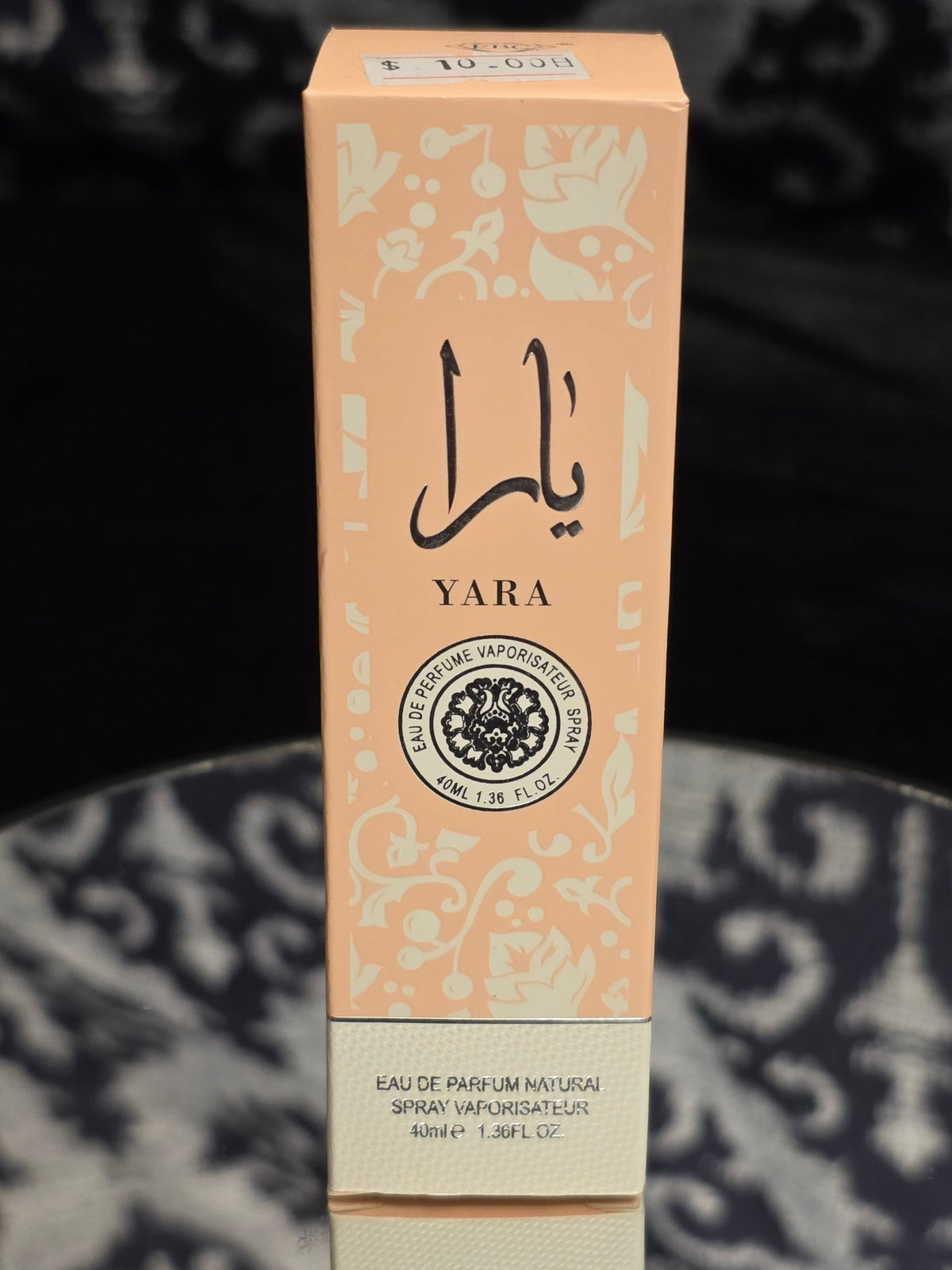 Yara Eau de Parfum 40mL box - soft blush peach packaging with Arabic calligraphy and delicate floral motif detailing